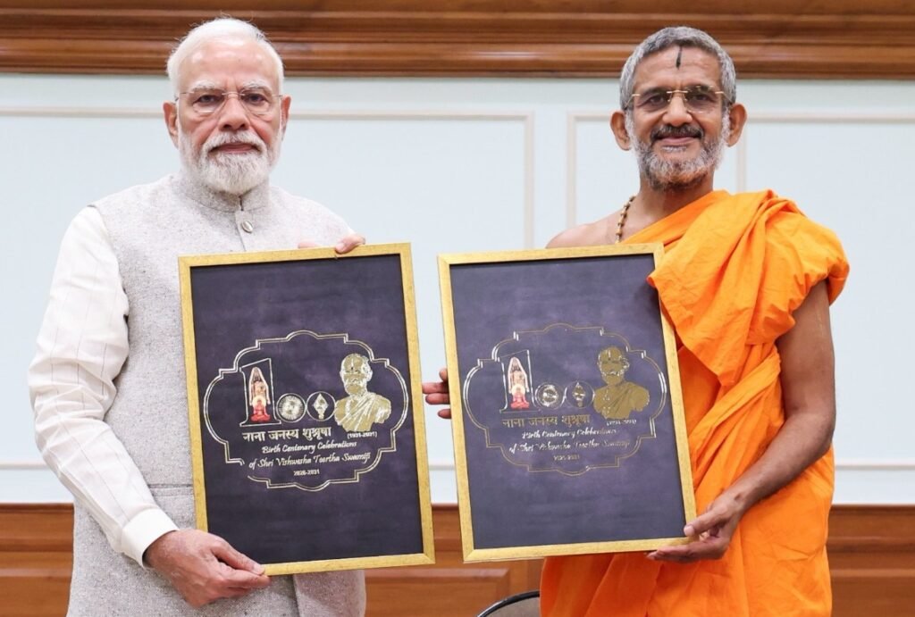Narendra-Modi-Pejawara-Vishwaprasanna-Tirtha-unveils-centenary-logo